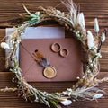 Wedding rings, wedding accessories in rustic style. invitation, brideÃ¯Â¿Â½s wreath