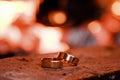 Wedding rings against the background of fire Royalty Free Stock Photo