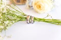 Wedding Rings Around Gypsophila on Wedding Table Royalty Free Stock Photo