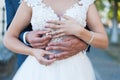 Wedding rings being exchanged close up on the hands