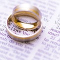 Wedding rings on a Bible with I Love You message Royalty Free Stock Photo