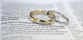 Wedding rings on Bible scripture