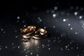 Wedding rings black background white rose drops Royalty Free Stock Photo