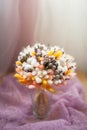 Wedding rings on bouquet of dry flowers. Royalty Free Stock Photo