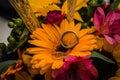 Wedding rings in a bouquet of yellow flowers Royalty Free Stock Photo