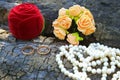 Wedding rings, boutonniere and a string of pearls Royalty Free Stock Photo