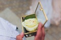 Wedding rings in the box and a bouquet of the bride in hand. Royalty Free Stock Photo
