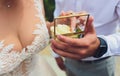Wedding rings in the box and a bouquet of the bride in hand. Royalty Free Stock Photo
