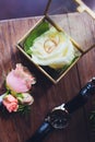 Wedding rings in the box and a bouquet of the bride on the table. Royalty Free Stock Photo