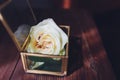 Wedding rings in the box and a bouquet of the bride on the table. Royalty Free Stock Photo