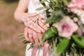 wedding rings of the bride and groom on the background of the bouquet Royalty Free Stock Photo