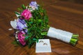 Wedding rings of the bride and groom on a Beautiful wedding bouquet. White ring box Royalty Free Stock Photo