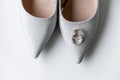 wedding rings on the bride\'s shoes