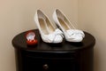 Wedding rings and bridesmaid shoes. Royalty Free Stock Photo