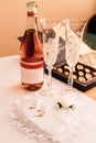 Wedding rings, champagne, sweets on the table. Wedding Day Royalty Free Stock Photo