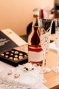 Wedding rings, champagne, sweets on the table. Wedding Day Royalty Free Stock Photo