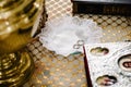 Wedding rings in church ready for marriage ceremony. close up. Bible, bowl in the church on table Royalty Free Stock Photo