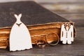 Wedding rings costumes and old book. Royalty Free Stock Photo