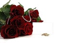 Wedding rings and dark red rose Royalty Free Stock Photo