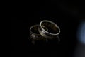 Wedding rings  on dark  table Royalty Free Stock Photo