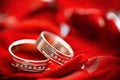 Wedding rings with diamonts on a deep red background Royalty Free Stock Photo