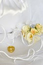 Wedding rings flowers and bridal bag over veil Royalty Free Stock Photo