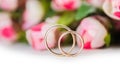The wedding rings and flowers isolated on white background Royalty Free Stock Photo
