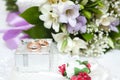 Wedding rings, gift box and flowers