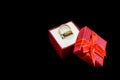 Wedding rings in gift box isolated on black Royalty Free Stock Photo