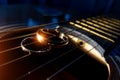 Wedding rings on guitar strings close-up on a dark background Royalty Free Stock Photo