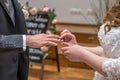 wedding rings and hands of bride and groom ring exchange couple at ceremony in love Royalty Free Stock Photo