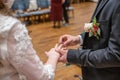 wedding rings and hands of bride and groom ring exchange couple at ceremony in love Royalty Free Stock Photo