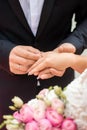 Wedding rings and hands of bride and groom. young wedding couple at ceremony. matrimony. man and woman in love. two happy people Royalty Free Stock Photo