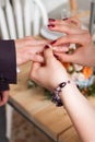 wedding rings and hands of bride and groom. young wedding couple at ceremony. matrimony. man and woman in love. two happy people c Royalty Free Stock Photo