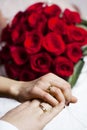 Wedding rings on hands of newlyweds