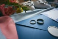 Wedding rings and wedding invitation. Shallow dof Royalty Free Stock Photo