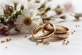 wedding rings lie on a beautiful bouquet as bridal accessories