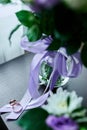 Wedding rings lie on a beautiful bouquet flowers as bridal accessories Royalty Free Stock Photo