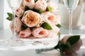 Wedding rings lie next to two glasses of champagne and a bouquet of roses Royalty Free Stock Photo