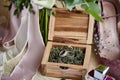 Wedding rings lie in the wooden box