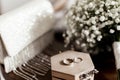 Wedding rings lie on a wooden box Royalty Free Stock Photo