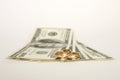 Wedding rings and money on a white background