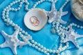 Wedding rings, nautical theme, starfish and pearl Royalty Free Stock Photo