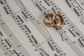 Wedding rings on old notes background for graphic and web design, Modern background. Internet concept. Trendy background for