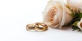 Wedding rings pastel roses white background copyspace Royalty Free Stock Photo