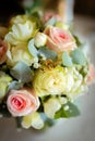 Wedding rings on a petal of a rose. Concept for a wedding card. The bride's bouquet.