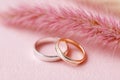 Wedding rings and pink muhly grass showing romance and commitment Royalty Free Stock Photo