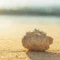 Wedding rings put on the beach. Royalty Free Stock Photo