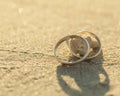 Wedding rings put on the beach Royalty Free Stock Photo