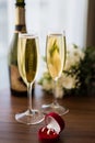 Wedding rings in a red box on the background of champagne glasses Royalty Free Stock Photo